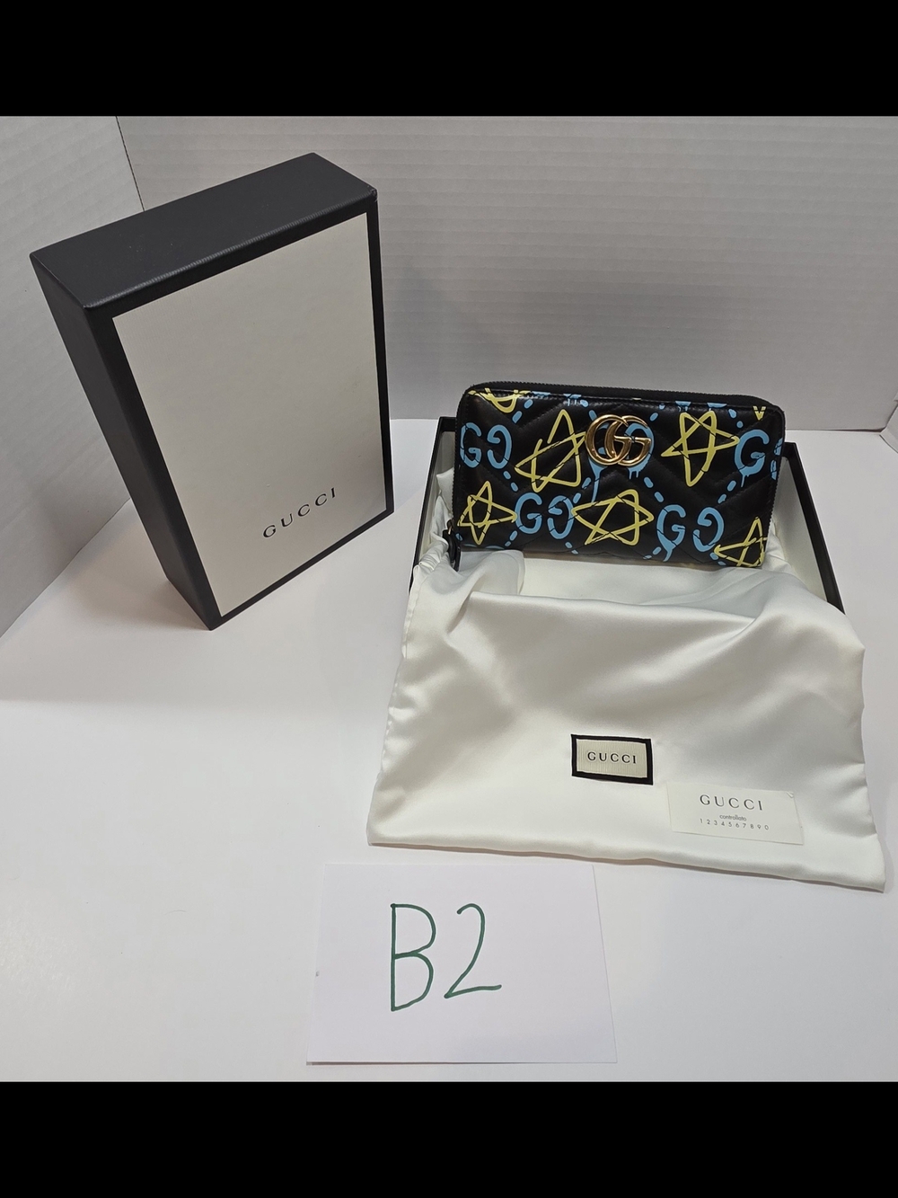Gucci GG Marmont wallet in the Guccighost graffiti print with antiqued gold-tone
